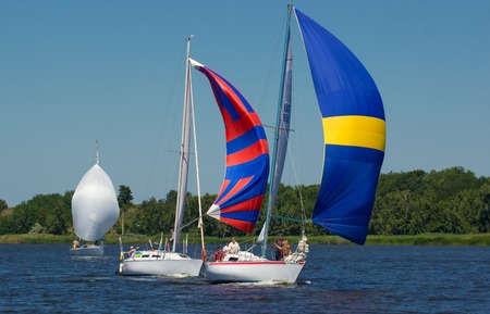 Pereyaslav Khmelnitsky , Ukraine, August 1, 2015:  Sailing Regatta, Cup of Pereyaslav 2015. Yacht on full sails compete with each other and race to the finish line.のeditorial素材