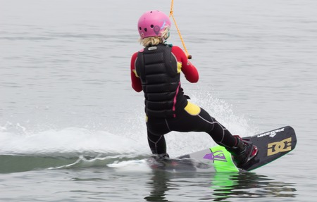 Lazurnoe , Ukraine, August 23, 2015:  Festival of music and sports Crayzy Day , Wakeboarder making tricks on sunsetのeditorial素材