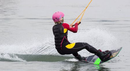 Lazurnoe , Ukraine, August 23, 2015:  Festival of music and sports Crayzy Day , Wakeboarder making tricks on sunsetのeditorial素材