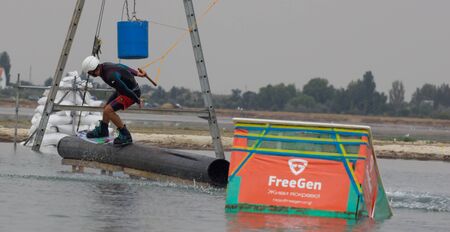 Lazurnoe , Ukraine, August 23, 2015:  Festival of music and sports Crayzy Day , Wakeboarder making tricks on sunsetのeditorial素材