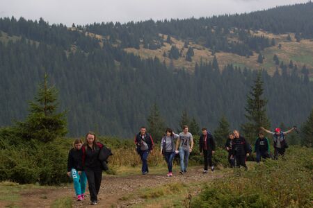 GOVERLA, UKRAINE - SEPTEMBER 20, 2015 : A group of tourists climbs to the highest mountain of Ukraine Hoverla 2061 METER on SEPTEMBER 20, 2015のeditorial素材