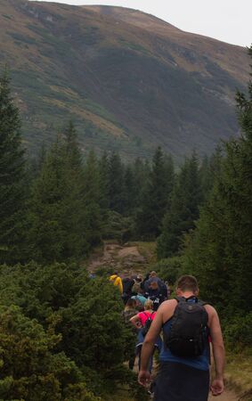GOVERLA, UKRAINE - SEPTEMBER 20, 2015 : A group of tourists climbs to the highest mountain of Ukraine Hoverla 2061 METER on SEPTEMBER 20, 2015のeditorial素材