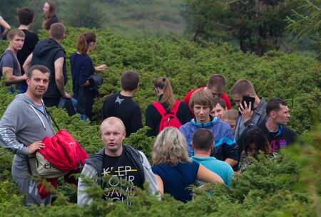 GOVERLA, UKRAINE - SEPTEMBER 20, 2015 : A group of tourists climbs to the highest mountain of Ukraine Hoverla 2061 METER on SEPTEMBER 20, 2015のeditorial素材