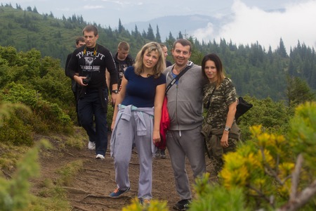 GOVERLA, UKRAINE - SEPTEMBER 20, 2015 : A group of tourists climbs to the highest mountain of Ukraine Hoverla 2061 METER on SEPTEMBER 20, 2015のeditorial素材