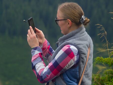 GOVERLA, UKRAINE - SEPTEMBER 20, 2015 : A group of tourists climbs to the highest mountain of Ukraine Hoverla 2061 METER on SEPTEMBER 20, 2015のeditorial素材