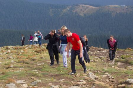 GOVERLA, UKRAINE - SEPTEMBER 20, 2015 : A group of tourists climbs to the highest mountain of Ukraine Hoverla 2061 METER on SEPTEMBER 20, 2015のeditorial素材