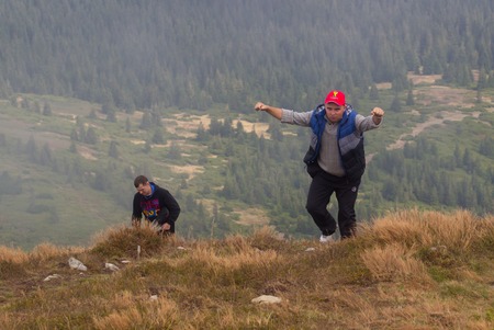 GOVERLA, UKRAINE - SEPTEMBER 20, 2015 : A group of tourists climbs to the highest mountain of Ukraine Hoverla 2061 METER on SEPTEMBER 20, 2015のeditorial素材
