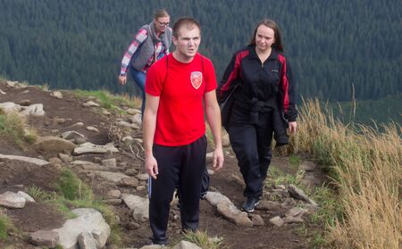 GOVERLA, UKRAINE - SEPTEMBER 20, 2015 : A group of tourists climbs to the highest mountain of Ukraine Hoverla 2061 METER on SEPTEMBER 20, 2015のeditorial素材