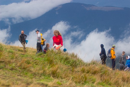 GOVERLA, UKRAINE - SEPTEMBER 20, 2015 : A group of tourists climbs to the highest mountain of Ukraine Hoverla 2061 METER on SEPTEMBER 20, 2015のeditorial素材