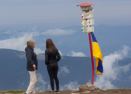 GOVERLA, UKRAINE - SEPTEMBER 20, 2015 : A group of tourists climbs to the highest mountain of Ukraine Hoverla 2061 METER on SEPTEMBER 20, 2015のeditorial素材