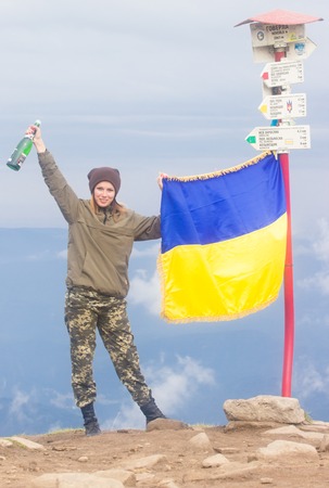 GOVERLA, UKRAINE - SEPTEMBER 20, 2015 : A group of tourists climbs to the highest mountain of Ukraine Hoverla 2061 METER on SEPTEMBER 20, 2015のeditorial素材