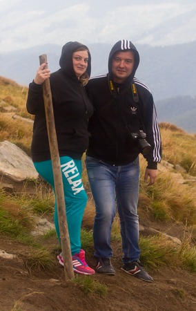 GOVERLA, UKRAINE - SEPTEMBER 20, 2015 : A group of tourists climbs to the highest mountain of Ukraine Hoverla 2061 METER on SEPTEMBER 20, 2015のeditorial素材