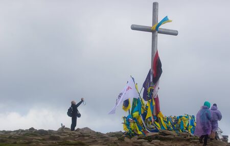 GOVERLA, UKRAINE - SEPTEMBER 20, 2015 : A group of tourists climbs to the highest mountain of Ukraine Hoverla 2061 METER on SEPTEMBER 20, 2015のeditorial素材