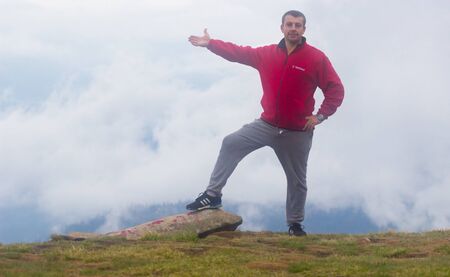 GOVERLA, UKRAINE - SEPTEMBER 20, 2015 : A group of tourists climbs to the highest mountain of Ukraine Hoverla 2061 METER on SEPTEMBER 20, 2015のeditorial素材