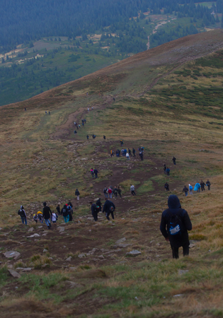 GOVERLA, UKRAINE - SEPTEMBER 20, 2015 : A group of tourists climbs to the highest mountain of Ukraine Hoverla 2061 METER on SEPTEMBER 20, 2015のeditorial素材