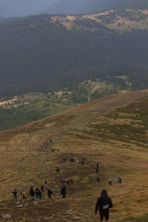 GOVERLA, UKRAINE - SEPTEMBER 20, 2015 : A group of tourists climbs to the highest mountain of Ukraine Hoverla 2061 METER on SEPTEMBER 20, 2015のeditorial素材