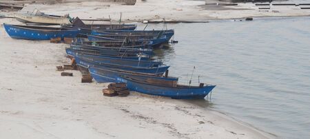 Old blue fishing boats, river Dnipro. Ukraineの写真素材