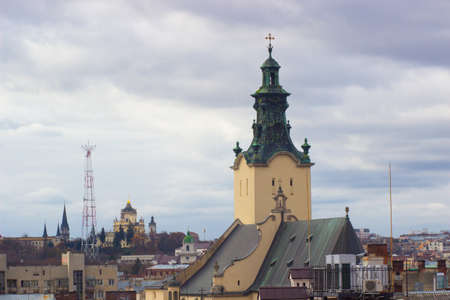 The high tower of The Assumption church among old roofs, Lviv, Ukraine. Historic city centerの写真素材