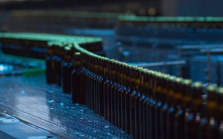 Beer bottles on the conveyor belt. Breweryの写真素材