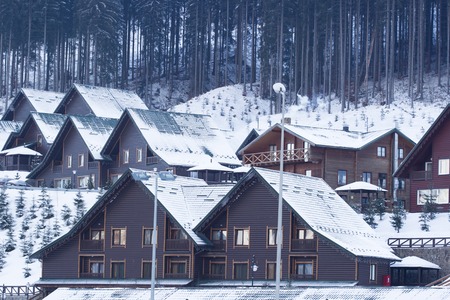 Winter mountain village panorama with fir fores. Carpathians, Ukraineの写真素材