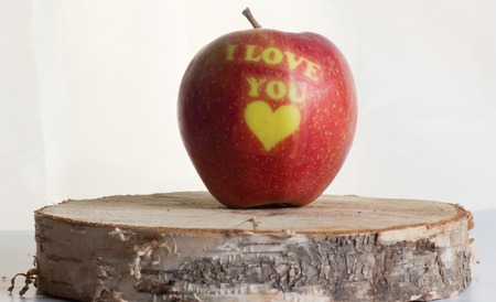 ripe red apple with the words "I love you"の写真素材