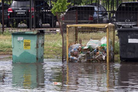 CHERKASSY, UKRAINE- JUNE 5, 2016: cars driving on a flooded road during a flood caused by heavy rain, in Cherkassy.のeditorial素材