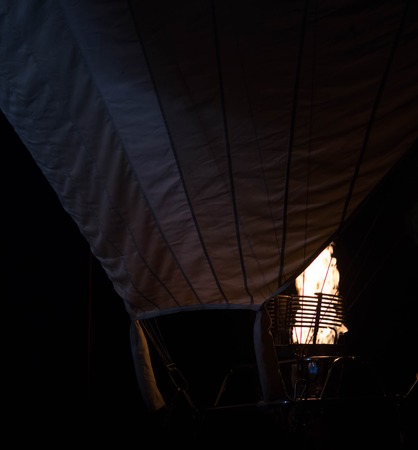 Air balloon in the evening sky. Fire in nightの写真素材