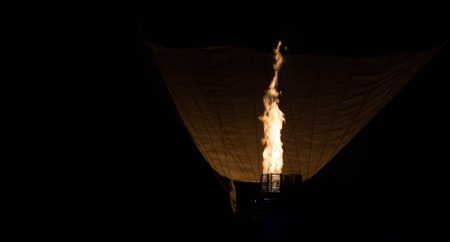 Air balloon in the evening sky. Fire in nightの写真素材