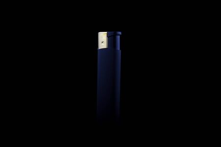 Cigarette Lighter on a black background in dark.の写真素材