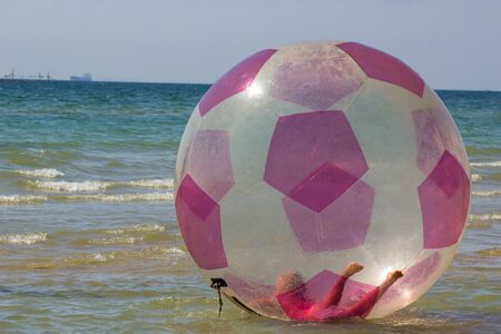 girl in water ball in sea. Aqwaball.の写真素材