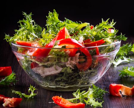 fresh healthy salad on the dark backgroundの写真素材