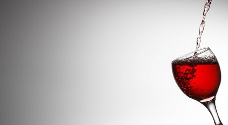 Red Wine Pouring in glass. For menuの写真素材