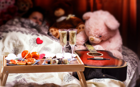 Healthy breakfast in bed with champagne. Valentines Day romantic conceptの写真素材