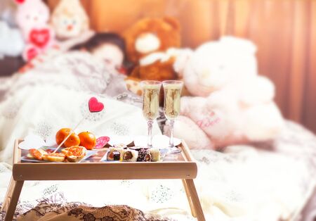 Healthy breakfast in bed with champagne. Valentines Day romantic conceptの写真素材