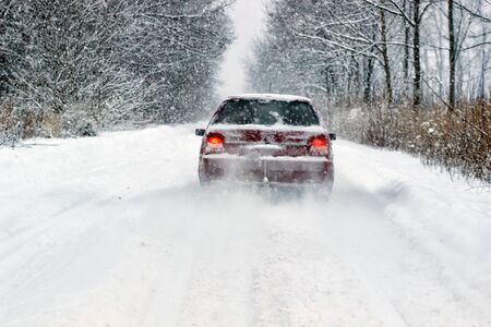 Cars with winter tires on snow-covered road