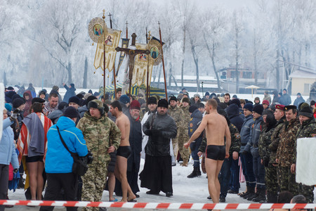 CHERKASSY, UKRAINE - January 19, 2017: Traditional ice swimming in Orthodox church Holy Epiphany Day. Ice cross and Ice-hole for bathing into sub-zero water on Epiphany day.のeditorial素材