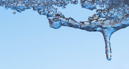icicles sparkling white with water drops ice hanging down.の写真素材