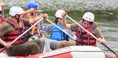 Migea Ukraine - June 17, 2017. Group of adventurer enjoying water rafting activity at river Migea...