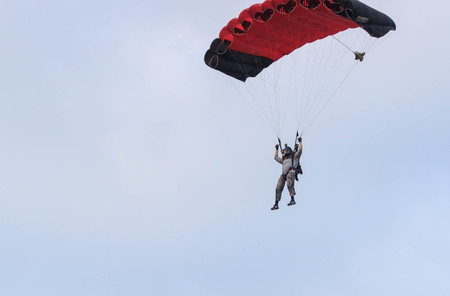 Sutiski, Ukraine - June 24, 2017: Skydivers carries a parachute after landing. Skydive Ukraine is the skydiving center located at Sutiski Aerodrome, about 20 km southwest of Vinitsa, Ukraine.のeditorial素材
