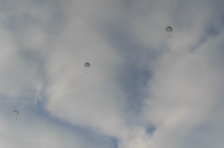 Sutiski, Ukraine - June 24, 2017: Skydivers carries a parachute after landing. Skydive Ukraine is the skydiving center located at Sutiski Aerodrome, about 20 km southwest of Vinitsa, Ukraine.のeditorial素材