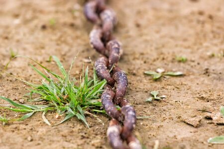 Photo picture background texture of a naval old rusty chain link.の写真素材