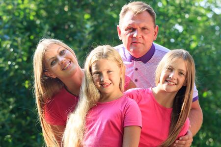 Portrait Of Happy Family In Garden