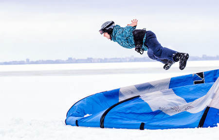 CHERKASSY, UKRAINE - January 29, 2017Snowboarder with kite on free ride. Sheregesh resort, Cherkassy, Ukraineのeditorial素材