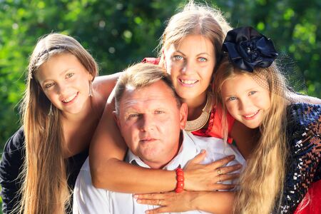 Portrait Of Happy Family In Garden