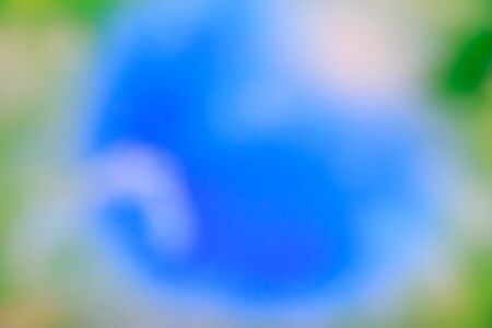 Eco friendly concept: Blurred beautiful green meadow and blue sky with sunshine background