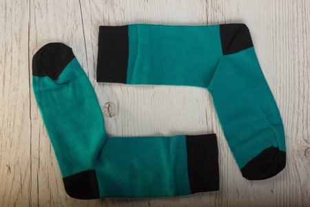 Textile colorful socks background. Green, pink, red, blue, yellow and other colorsの写真素材