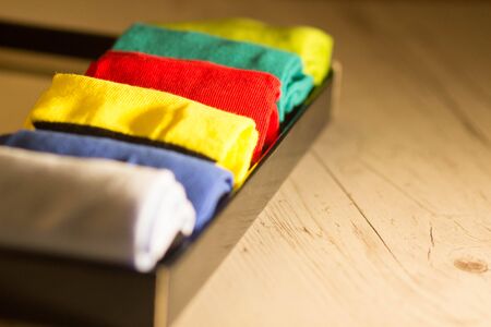 Textile colorful socks background. Green, pink, red, blue, yellow and other colorsの写真素材
