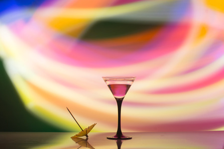 colourful cocktail on the club light background. Party club entertainment. Mixed lightの写真素材
