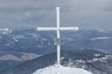 Freeride skier with rucksack running downhill in freeze motion of snow powderの写真素材