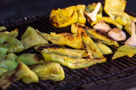 Background of grilled vegetables on a grill macro.の写真素材
